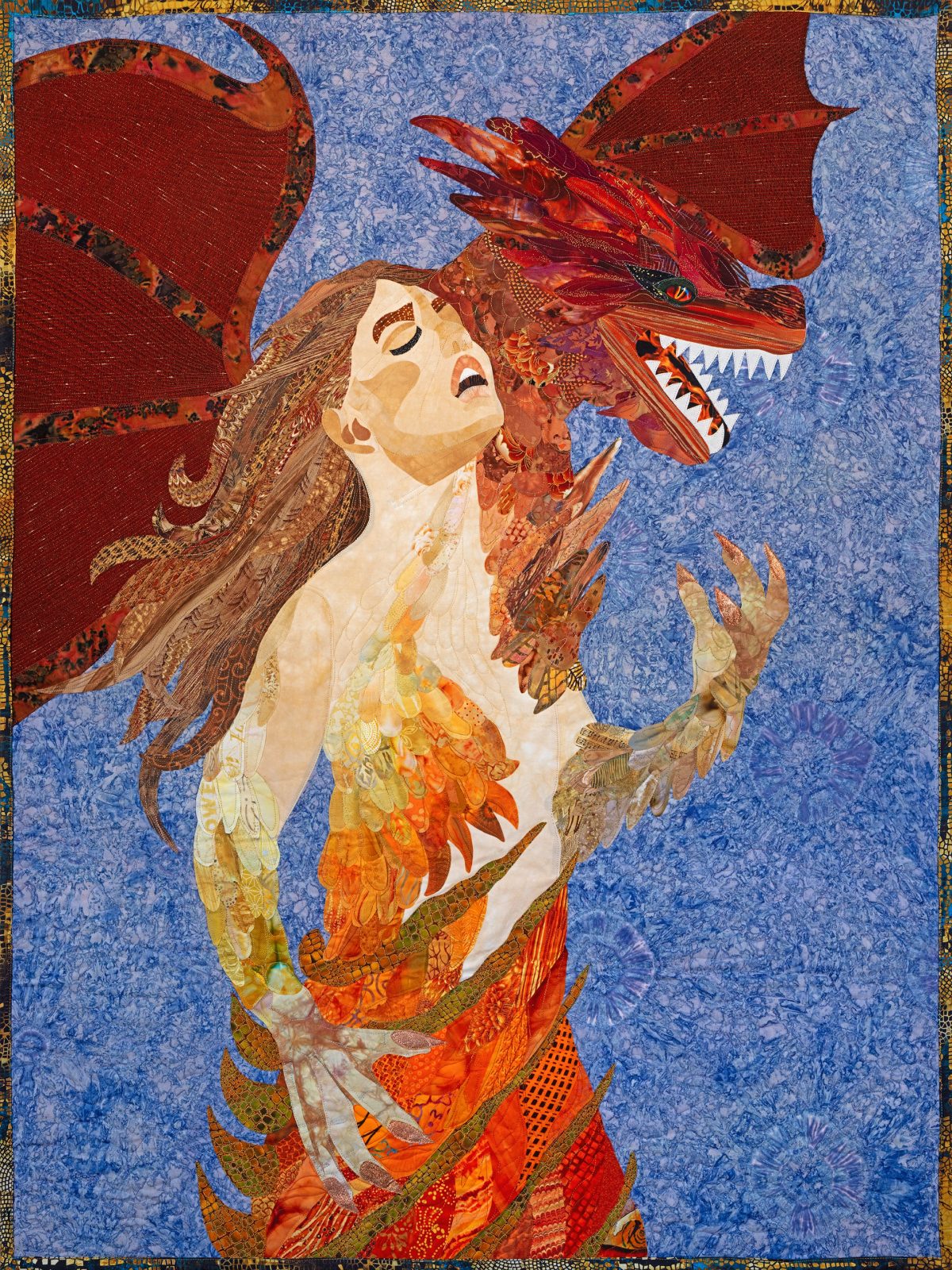 The Shape of Her Fury. A woman transforming into her power with a dragon on a shoulder. Quilted canvas art by Robin Beattie.